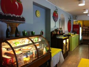 a restaurant with a display case with food at Albergo Ristorante Pomodoro in Omegna