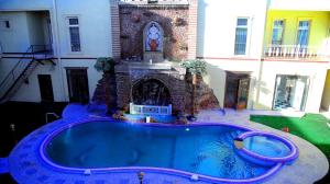 a swimming pool in the backyard of a house at Hotel Khiva Palace in Khiva