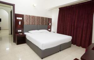 Ένα ή περισσότερα κρεβάτια σε δωμάτιο στο Samara Hotel