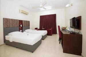 Ένα ή περισσότερα κρεβάτια σε δωμάτιο στο Samara Hotel