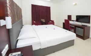 Ένα ή περισσότερα κρεβάτια σε δωμάτιο στο Samara Hotel