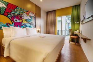 MaxOneHotels at Resort Makassar客房内的一张或多张床位