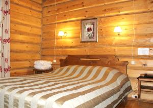 Кровать или кровати в номере Гостиничный комплекс Колыба