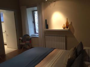 Postel nebo postele na pokoji v ubytování B&B A ti