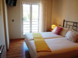 Postel nebo postele na pokoji v ubytování Apartamento Ainsa Pirineo
