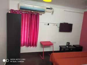 TV a/nebo společenská místnost v ubytování The coloursinn Home stays