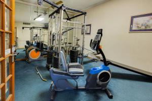 a gym with a exercise bike and a treadmill at OYO Hotel Tyler Lindale in Tyler