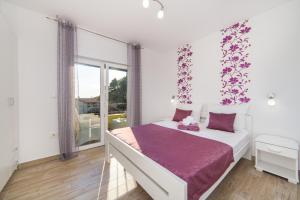 Posteľ alebo postele v izbe v ubytovaní Apartments Maša + 37 fotografií