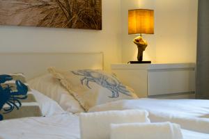 Ένα ή περισσότερα κρεβάτια σε δωμάτιο στο Robben Hüs