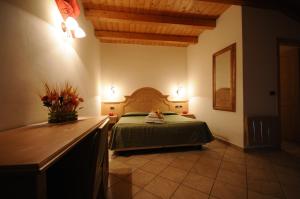 Säng eller sängar i ett rum på Agritur Campo Fiorito