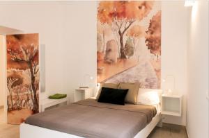 Postel nebo postele na pokoji v ubytování Angolo sul Giardino