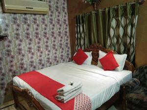 Postel nebo postele na pokoji v ubytování Hotel Rashmi