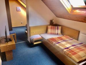 Postel nebo postele na pokoji v ubytování hotel Nautilus