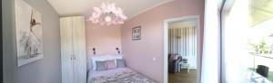 Posteľ alebo postele v izbe v ubytovaní Apartament Malinowy Zakątek Triventi Mountain Residence