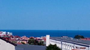 a view of a city with the ocean in the background at Guest House Diamant in Sozopol
