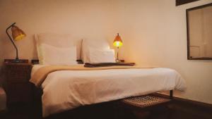 Кровать или кровати в номере CURIOCITY Backpackers Johannesburg