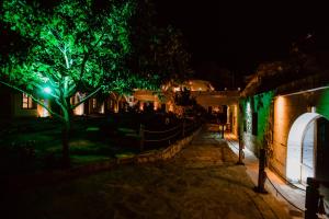 a street lit up at night with green lights at Ortahisar Cave Hotel in Ortahisar
