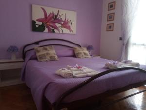Verona Bottego Guest House tesisinde bir odada yatak veya yataklar