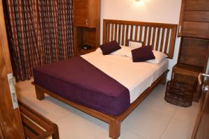 A bed or beds in a room at Port View City Hotel