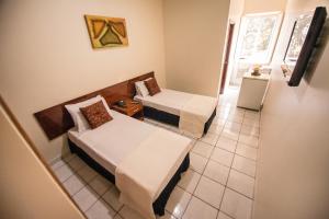 En eller flere senge i et værelse på HAVANA ECONOMY