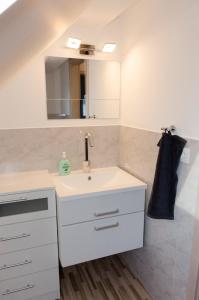 a bathroom with a sink and a mirror at Ferien - Knierer in Bärnau