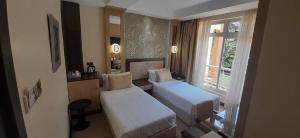 Katil atau katil-katil dalam bilik di Elysian Resort