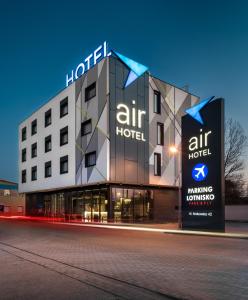a large building with a sign on the side of it at Air Hotel in Warsaw