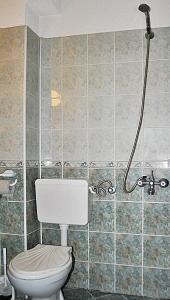 a bathroom with a toilet and a shower at Family hotel Zora in Sofia +9 photos