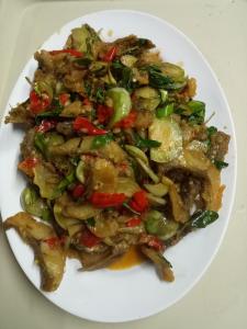 a plate of food on a white plate at Samoeng fishing park home stay in Samoeng
