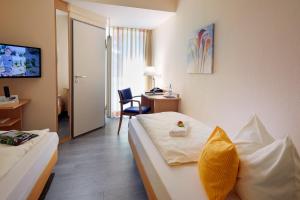 
Ein Bett oder Betten in einem Zimmer der Unterkunft In Via Hotel
