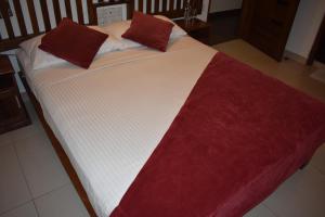 A bed or beds in a room at Port View City Hotel