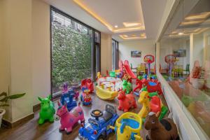 a childrens play room with many toys on the floor at Snow Valley Resorts Shimla in Shimla