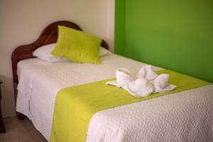 Voodi või voodid majutusasutuse Hostal Gladismar toas