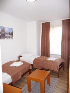 Кровать или кровати в номере Sobe Rooms Aleksandar