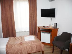 TV i/ili multimedijalni sistem u objektu Sobe Rooms Aleksandar