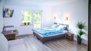 Łóżko lub łóżka w pokoju w obiekcie Dom Gościnny u Rekina