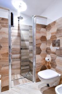 a bathroom with a toilet and a shower at Il Profumo di Capri in Massa Lubrense +33 photos