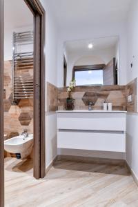 a bathroom with a sink and a mirror at Il Profumo di Capri in Massa Lubrense