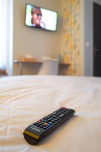 TV a/nebo společenská místnost v ubytování L'étoile d'Alice