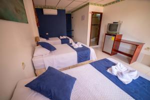 Voodi või voodid majutusasutuse Hostal Gladismar toas