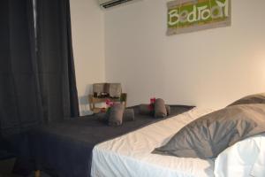 Postel nebo postele na pokoji v ubytování LES VILLAS TARA ET ANAIS + 18 fotografií