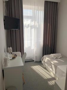 Postel nebo postele na pokoji v ubytování MEDELEAN HOTEL