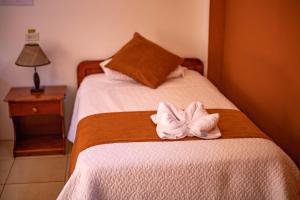 Voodi või voodid majutusasutuse Hostal Gladismar toas