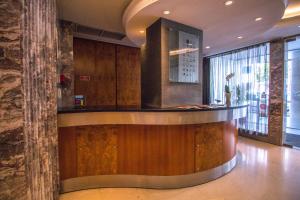 a lobby with a bar in a building at Hotel Travel Park Lisboa in Lisbon