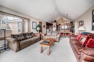 a large living room with couches and a table at Pitkin Townhome 704 in Frisco