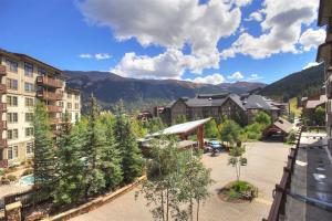 a view of a resort with trees and buildings at Passage Point 311 Condo in Frisco