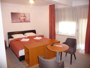 Krevet ili kreveti u jedinici u okviru objekta Sobe Rooms Aleksandar