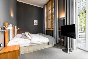 Postel nebo postele na pokoji v ubytování YoHo - The Young Hotel