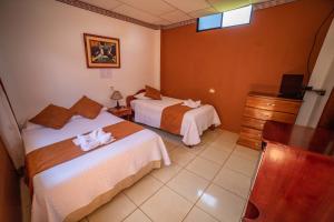 Voodi või voodid majutusasutuse Hostal Gladismar toas