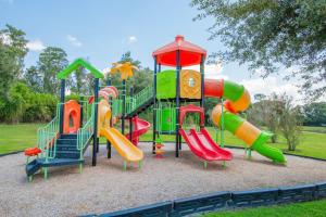 a playground with a slide at Berkley Lake Townhomes in Kissimmee